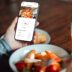 Young Woman Using Mobile App To Track Nutrition And Royalty Free Image 1671636625.jpg